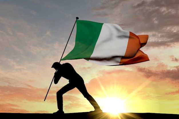 Vlag van Ierland wordt in de grond geduwd door een mannelijk silhouet 3D Rendering