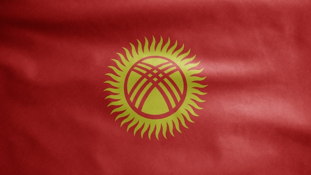 Vlag van Kirgizië zwaaien in de wind. Close up van Kirgizië banner waait, zacht en glad zijde. Doek stof textuur vlag achtergrond.