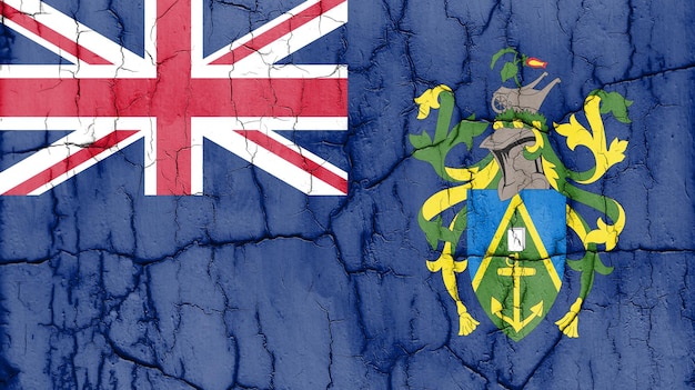 Vlag van Pitcairn Islands op gebarsten muur getextureerde achtergrond