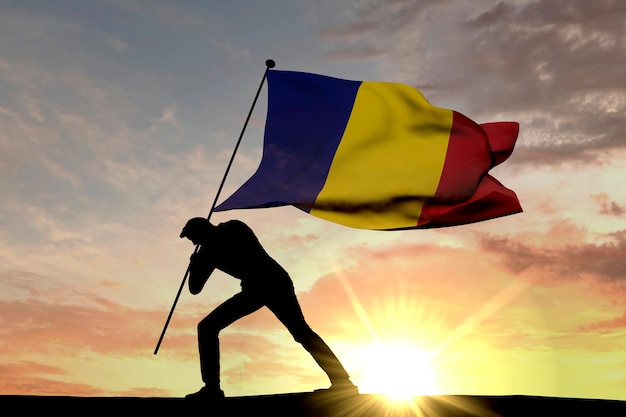 Vlag van Roemenië wordt in de grond geduwd door een mannelijk silhouet 3D Rendering