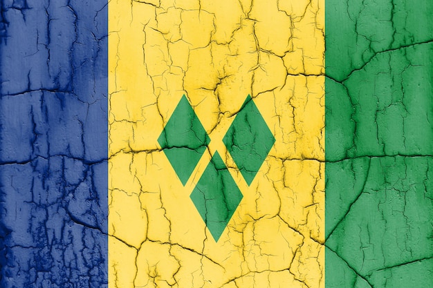 Vlag van Saint Vincent en de Grenadines op gebarsten muur gestructureerde achtergrond