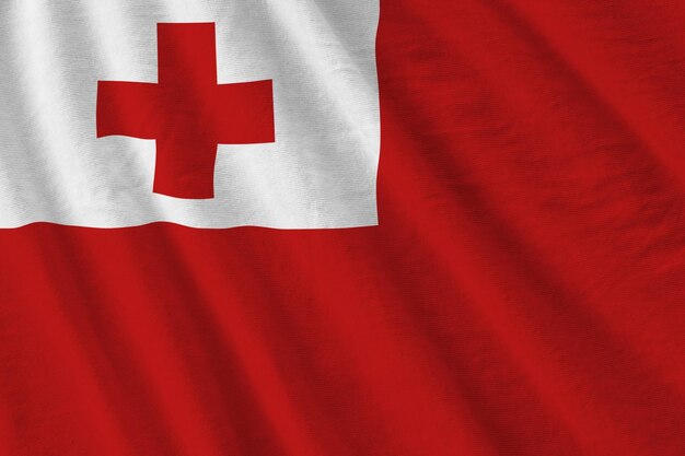 Vlag van Tonga met grote vouwen die van dichtbij zwaaien onder het studiolicht binnenshuis de officiële symbolen en co