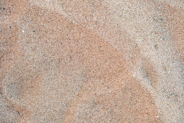 Vlak zicht op een schoon geel zandoppervlak dat het strand aan zee bedekt Zandtextuur