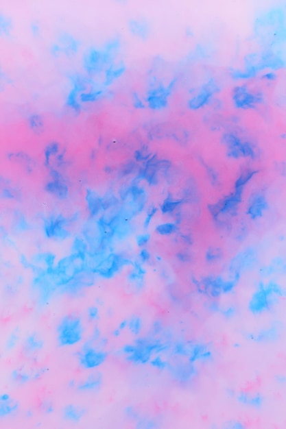 Vloeibare kunst Roze en blauwe vlekken op een witte achtergrond Mooie verf Vloeibare kleur achtergrond