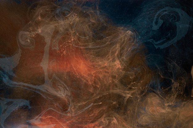 Vloeibare vloeistof kunst abstracte achtergrond Oranje blauwe acrylverf onderwater galactische rook oceaan