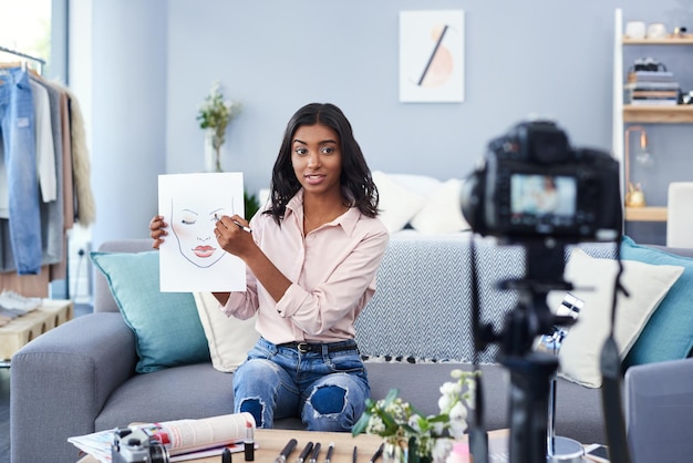 Vlogging is a great way to help others Cropped shot of an attractive young woman working at home