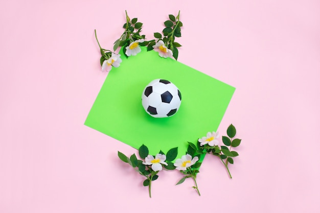 Foto voetbal en bloemen