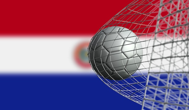 Foto voetbal scoort een doelpunt in een net tegen de vlag van paraguay 3d rendering