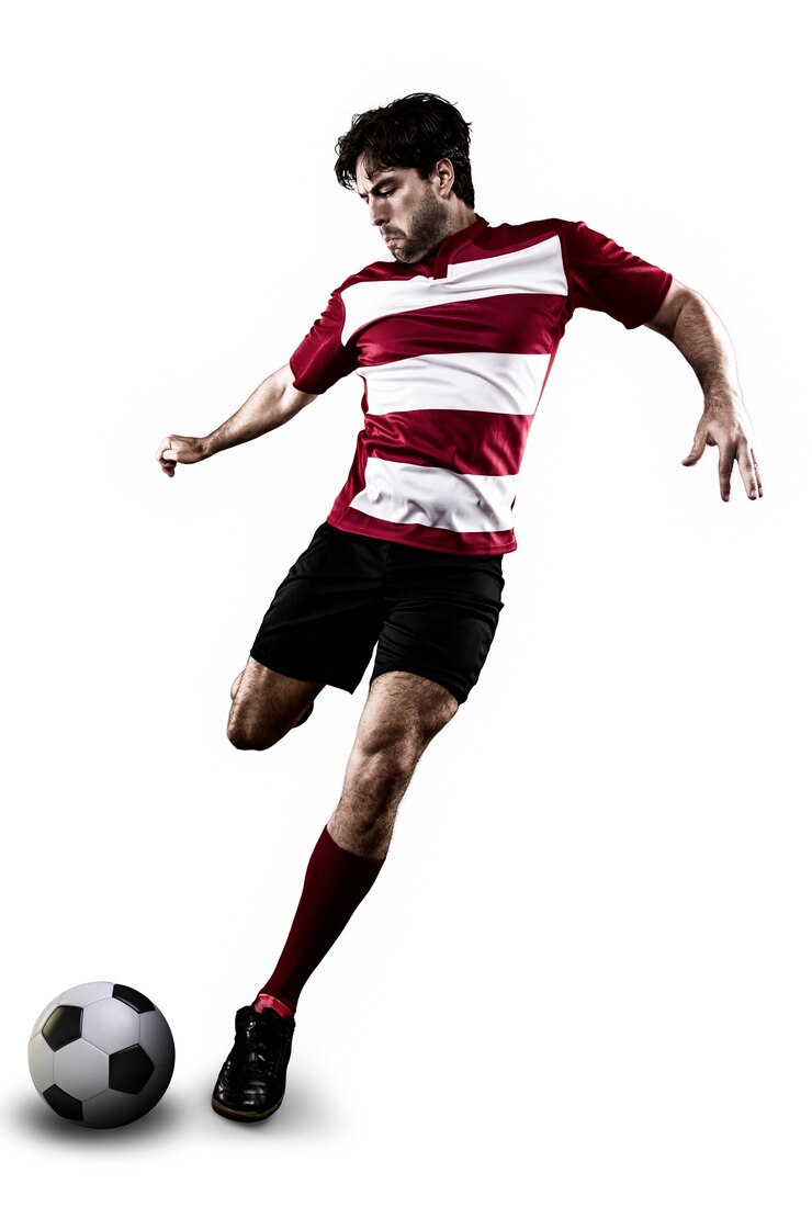 Voetballer in een rood uniform schoppen.