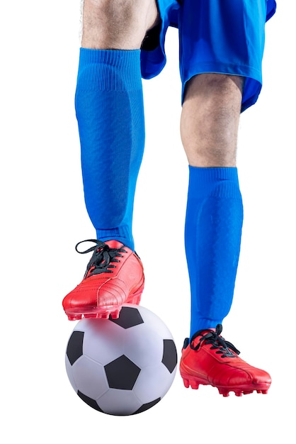 Foto voetballer man in een blauwe trui met de bal