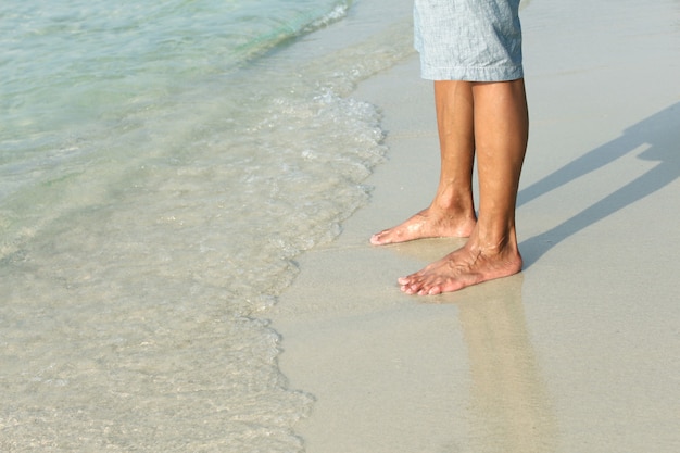 Voeten op een zand