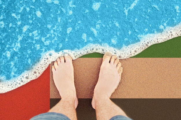 Voeten strand zee achtergrond Mannelijke voeten in zee zand bovenaanzicht