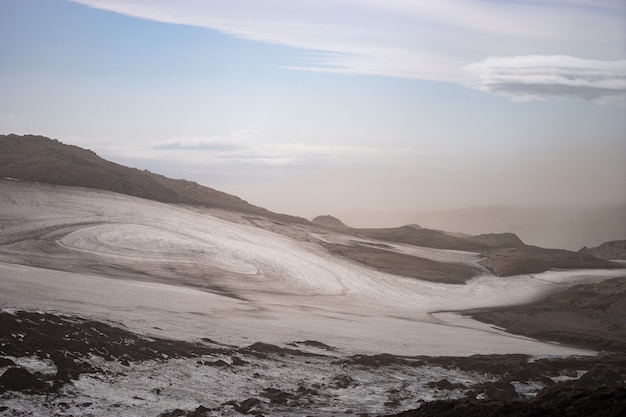 Volcanic landscape with glacier, rocks and ash on the Fimmvorduhals hiking trail. Iceland.