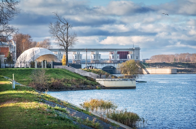 Volga river embankment and view of the Hydroelectric Power Station Museum in Uglich in the rays of the autumn sun