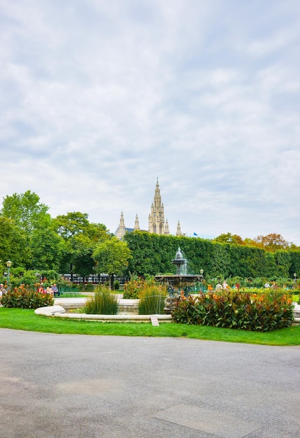 Volksgarten or People Garden park of Hofburg Palace in Vienna, Austria. Tourists on the background