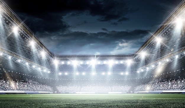 Volle nacht voetbalarena in lichten en flitsen