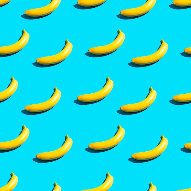 Foto volledige opname van bananen tegen een blauwe achtergrond