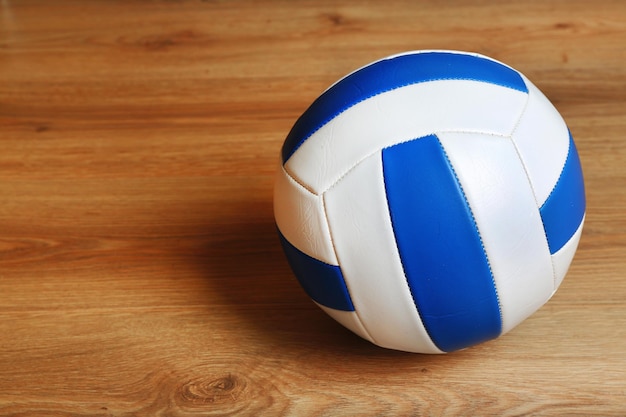 Volleyball ball on wooden background