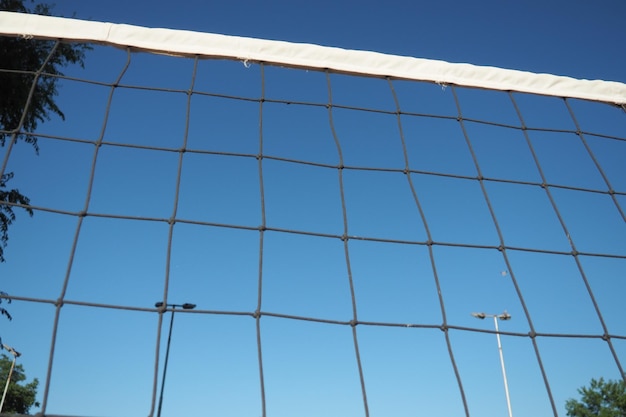 Volleyball sports dividing net against the blue sky closeup Outdoor sports