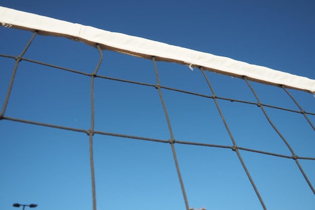 Volleyball sports dividing net against the blue sky closeup Outdoor sports