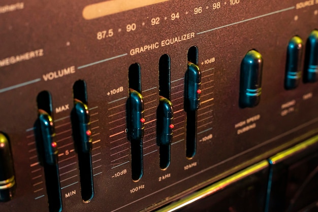 Volume and equalizer controller detail in an old stereo\
equipment