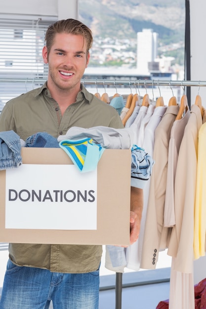 Volunteer holding donation box