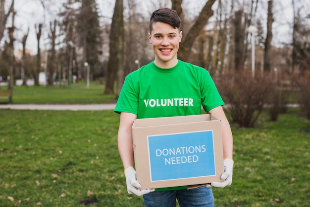 Volunteer holding donation box