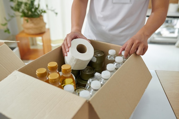 Volunteer packing food and necessities