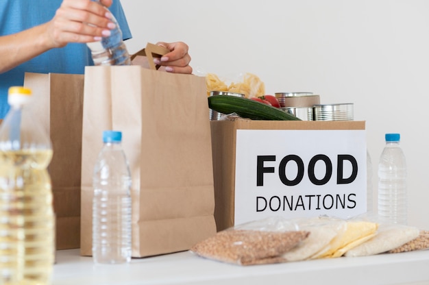 Volunteer preparing bag with provisions for donation