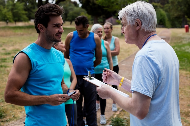 Photo volunteer registering athletes name for race