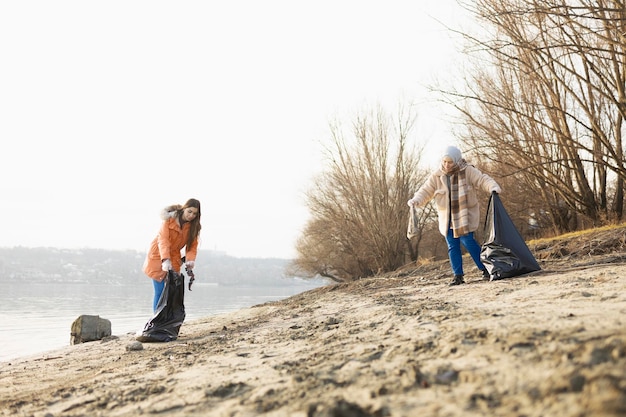 Volunteer team cleaning up rubbish from the beach