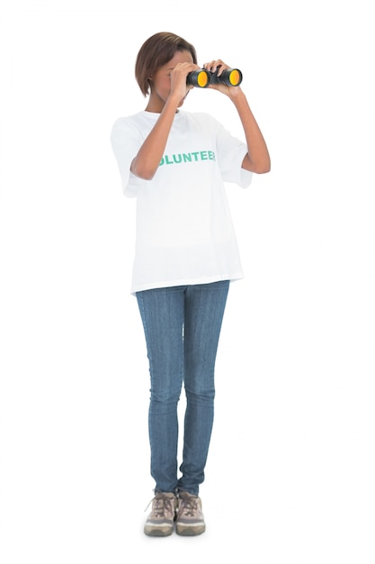 Volunteer woman looking through binoculars