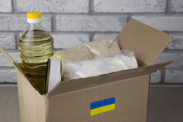 Volunteers collecting donations for the needs of ukrainian migrants humanitarian aid concept