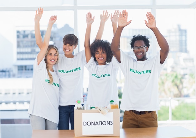 Photo volunteers raising their arms