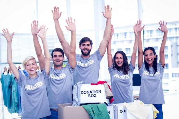 Photo volunteers raising their hands