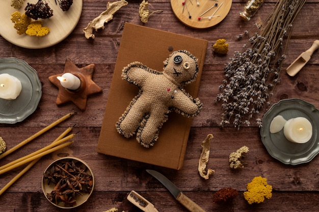 Voodoo doll and esoteric items flat lay