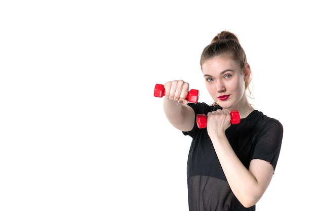 vooraanzicht jonge vrouw uit te werken met halters op witte achtergrond circus yoga lichaam atleet sportschool sport lifestyle