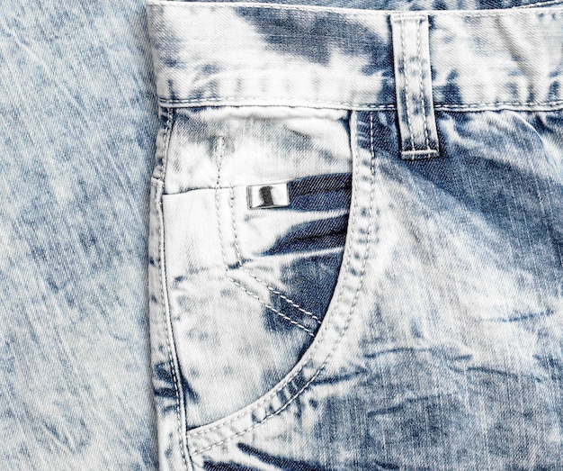 Voorvak van lichtblauwe jeans Close up
