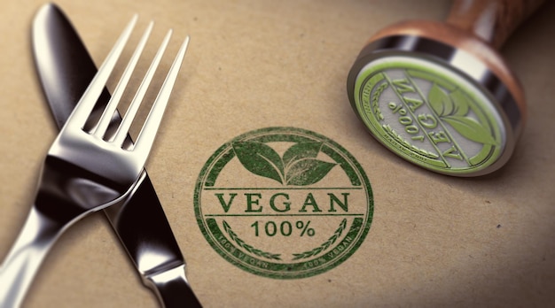 Vork, mes en rubberen stempel met de tekst vegan gestempeld op kartonnen achtergrond. Restaurantconcept. 3D illustratie.