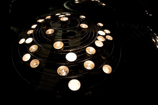 Votive candles in paris cathedral notre dame