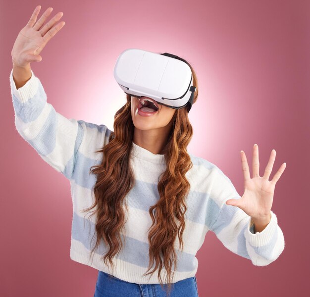 vr metaverse and gaming with a woman using a headset to access the online world of innovation ai 3d and virtual reality with a female gamer in studio on a pink background using future technology