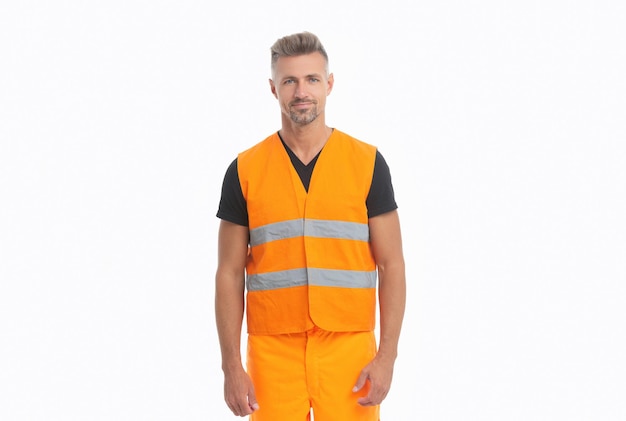 Vrolijke bouwer supervisor man in oranje uniforme bouwer man met werkend reflecterend vest