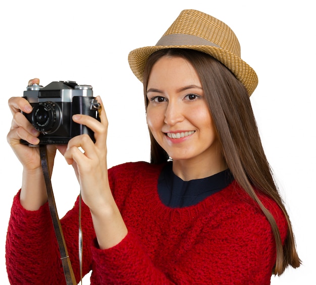 Vrolijke jonge vrouw met camera