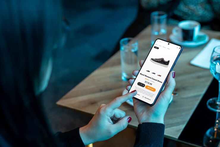 Foto vrouw gebruikt mobiele telefoon om schoenen te kopen moderne e-commerce-app met een gebruiksvriendelijke interface online winkelen concept voor gemak en efficiëntie