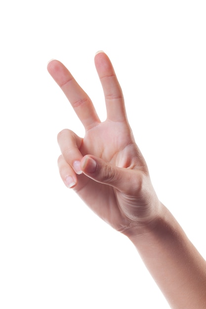 Vrouw hand weergegeven: overwinning teken geïsoleerd op wit. Lichaamstaal.