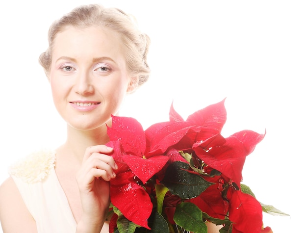 Vrouw met rode kerstbloemen