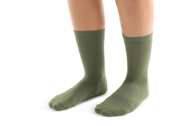 Vrouwelijke benen in groene sokken geïsoleerd op witte achtergrond