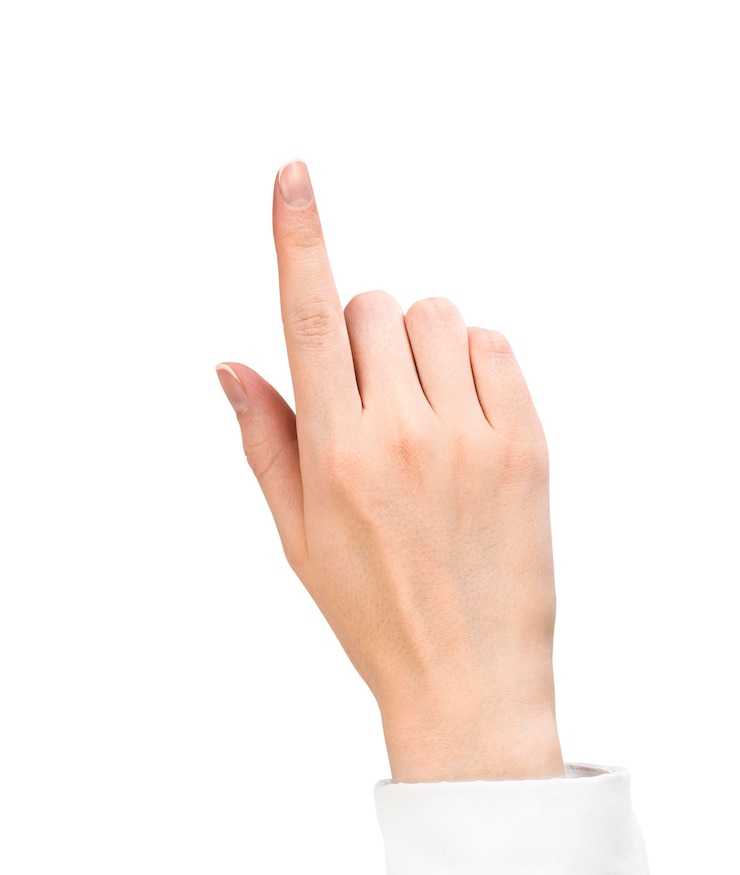 Foto vrouwelijke hand in wit overhemd wijst met wijsvinger naar iets, geïsoleerd op een witte achtergrond