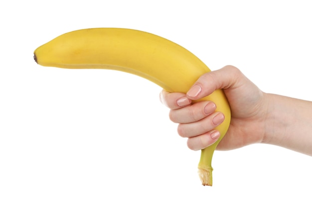 Vrouwelijke hand met banaan geïsoleerd op wit