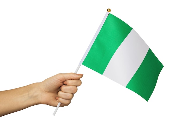 Vrouwelijke hand met de vlag van Nigeria geïsoleerd op een witte achtergrond sjabloon voor ontwerpers
